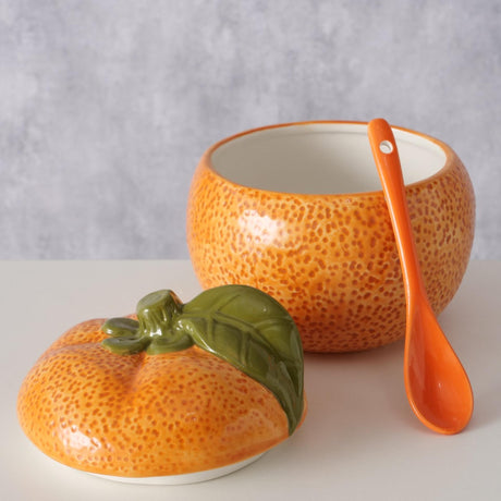 Boltze home pomarańczowy słoik na dżem z łyżeczką śr.13x12cm 480ml z dolomitu
