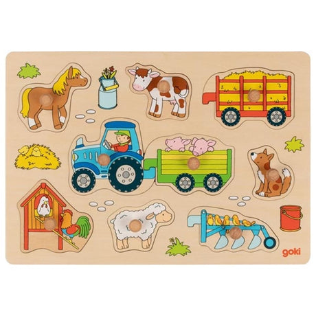 Traktor z puzzlami na guziki z przyczepami. 9 części