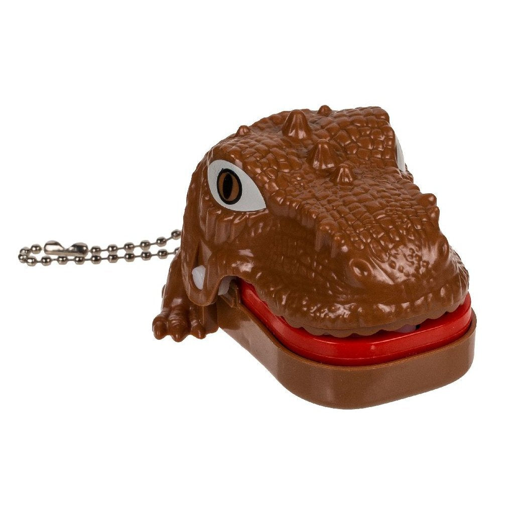 Różne marki breloków do kluczy Dino z bólem zęba