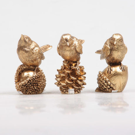 Season inspired decoation vogel op noot goud 5x3x6cm 3 assorti